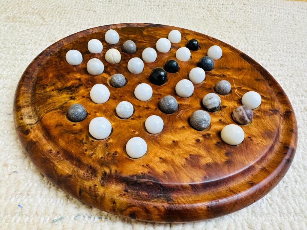 Handmade Moroccan thuya wood solitaire game board with marble stone balls