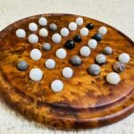 Handmade Moroccan thuya wood solitaire game board with marble stone balls